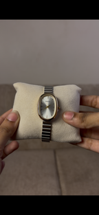 Naidu oval gold border silver strap
